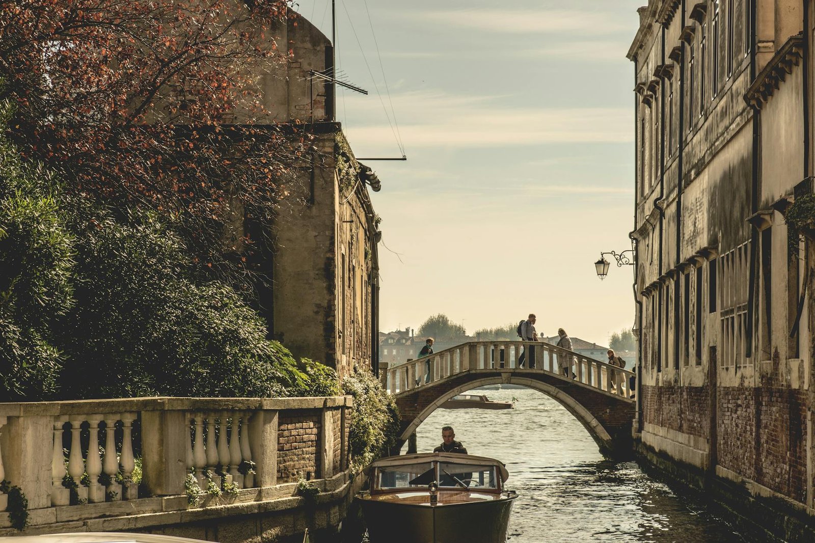 white concrete bridge between houses